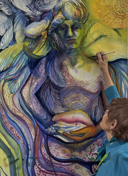 Diana Marta painting Endless  a 6' high by 40 wide wide watercolor of a woman with wings holding a conch shell. Photo by Cheri Glover