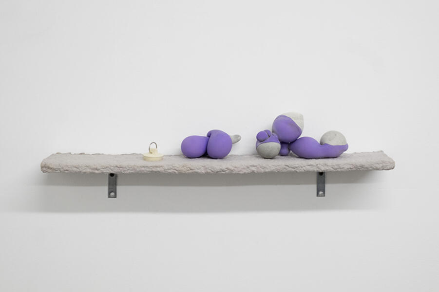 Play Party, 2018. Wood, concrete, latex, paper pulp, table legs.  35” x 24” x 30” 