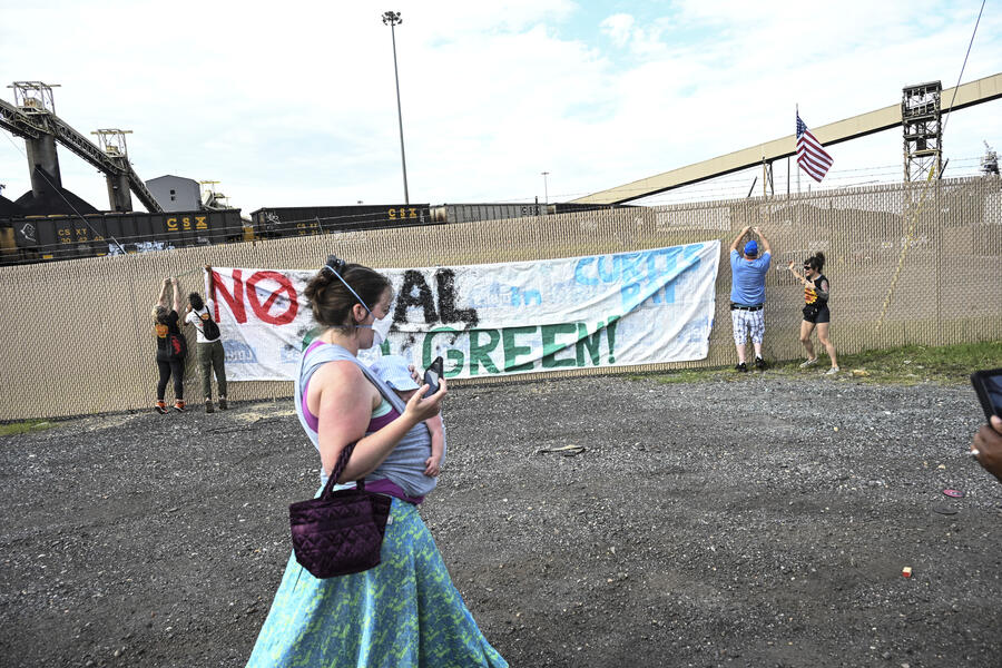 Mother and child against coal