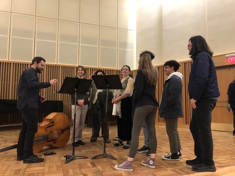 LIGAMENT talking with students on stage after their guest artist recital