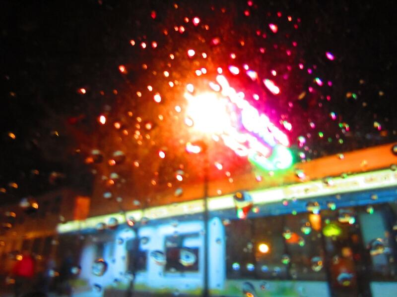 diner stop through a rainy car window