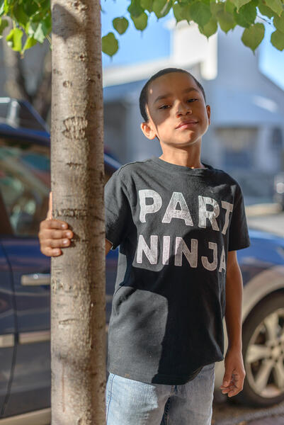 Isaiah outside of Jubilee Arts, Baltimore, Maryland, 2015