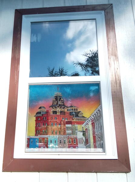 Painted window screen of the former American Brewery.