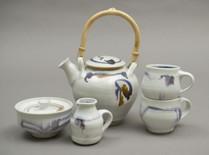 Porcelain teapot, mugs, sugar bowl, creamer