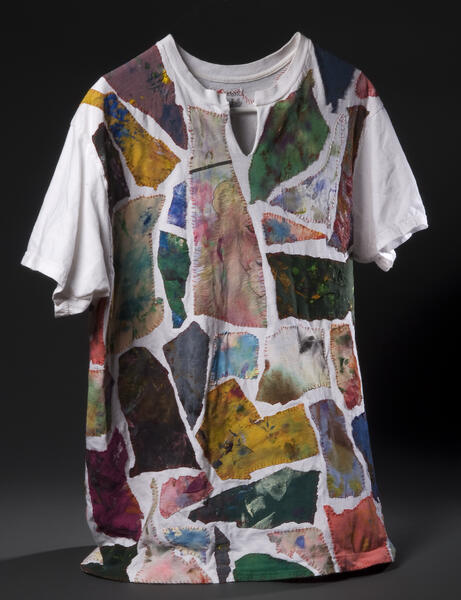White t-shirt with colorful painting rag scraps hand-sewn onto it.