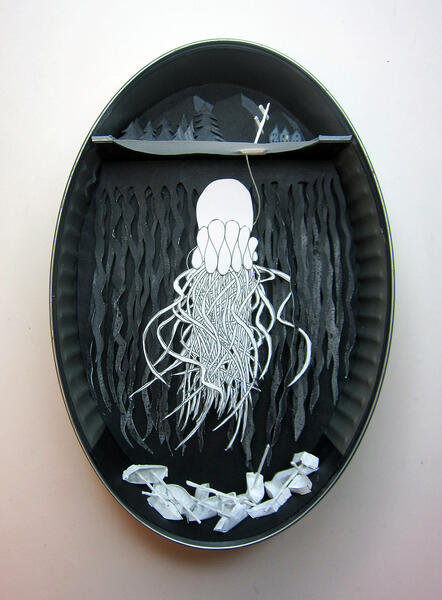 Paper Cut-outs in sardine tin showing a jellyfish below the surface of a lake, above the wreckage of many boats.
