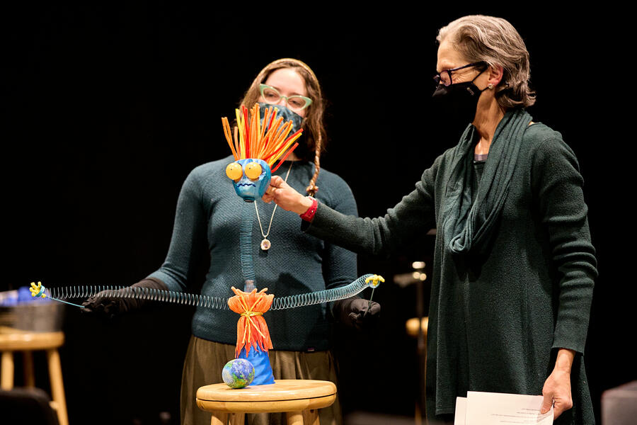 Two women puppeteer Genny (short for Generalized Anxiety) in a performance of Winter Seeds in 2021