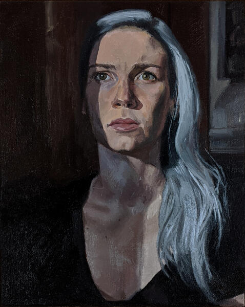 portrait of the artist with sun on half her face and blue grey hair