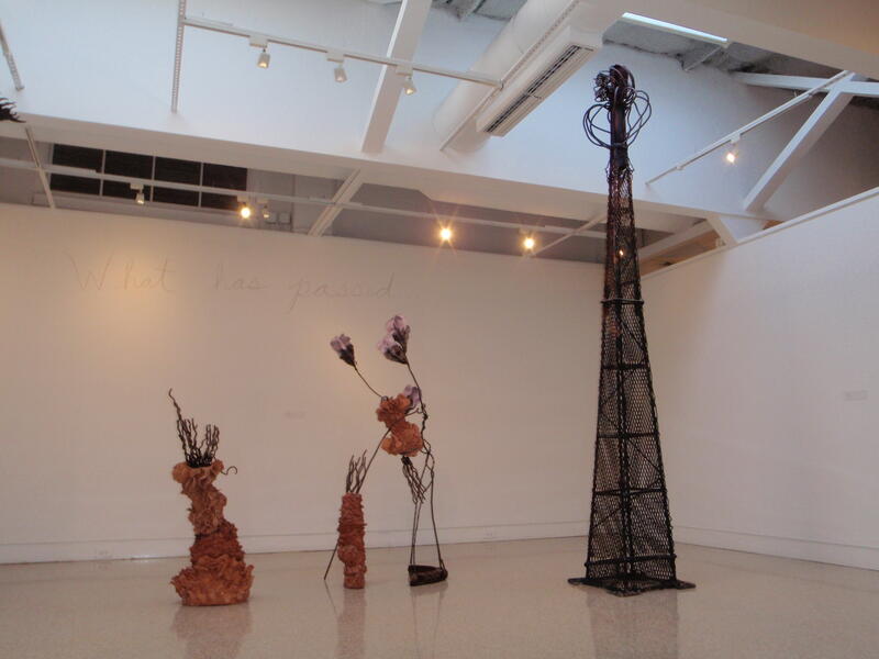Moving Onwards from Before, 2010, 14 ft x 12 ft x 6 ft, welded steel and clay, 14 ft tall welded steel "tower " with a smaller welded steel organic formed structure, with a fired red clay undersea form attached, then other clay sculpture next to it