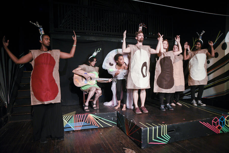 The whole cast dressed as canned beans.