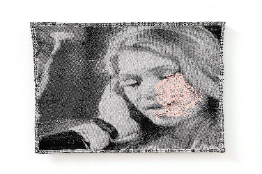 woven portrait of a woman with a rosette pattern overlaid on her cheek 