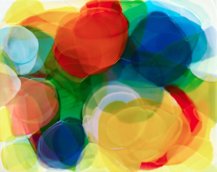 Colorful painting with red, blue, green, yellow and rose colors in circular overlays