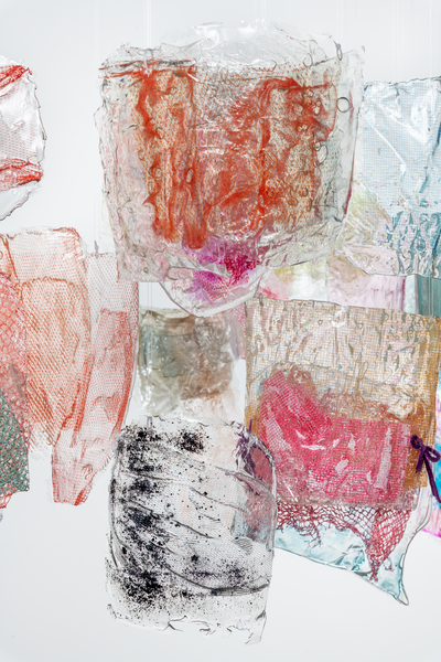 detail of installation art of hanging resin and mesh pieces