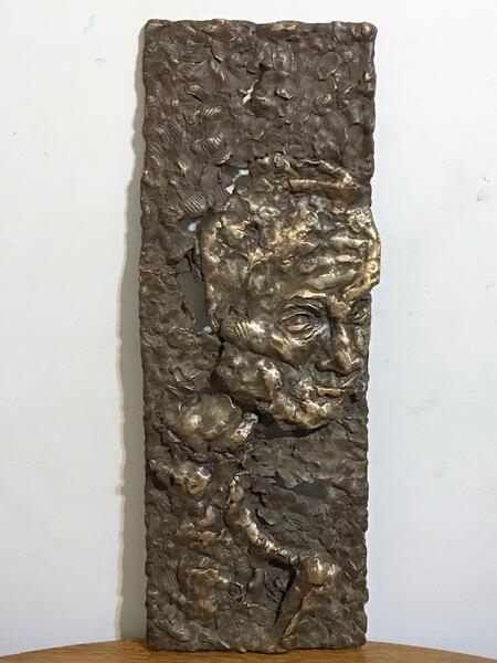 Bronze, bas-relief head