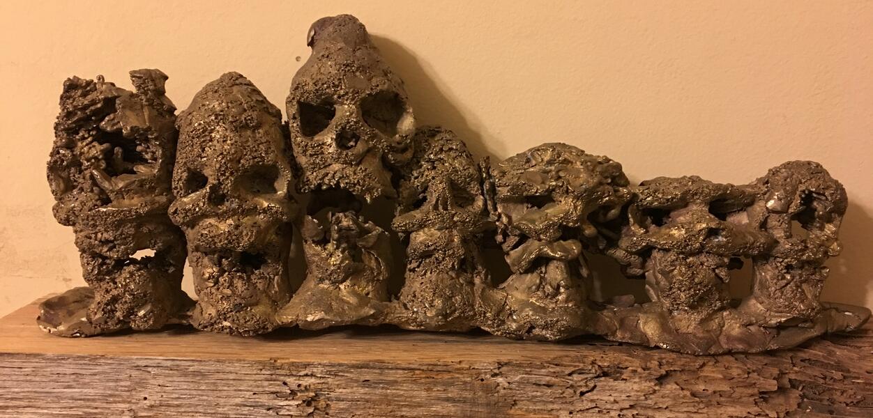 Pinecones modeled in wax and then cast. On wooden base