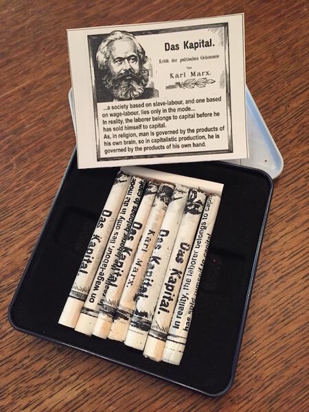 Smoking Marx, a tin of hand rolled cig.