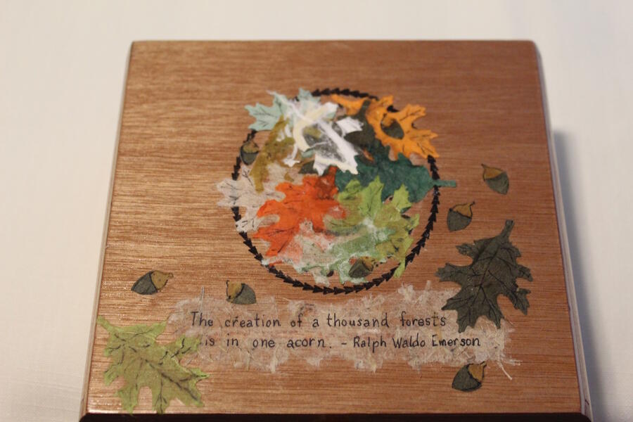 Autumn colored leaves and acorns combined with art original to a cigar box 