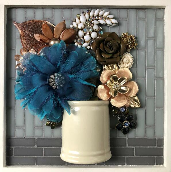 Flower bouquet created with glass tiles and found objects