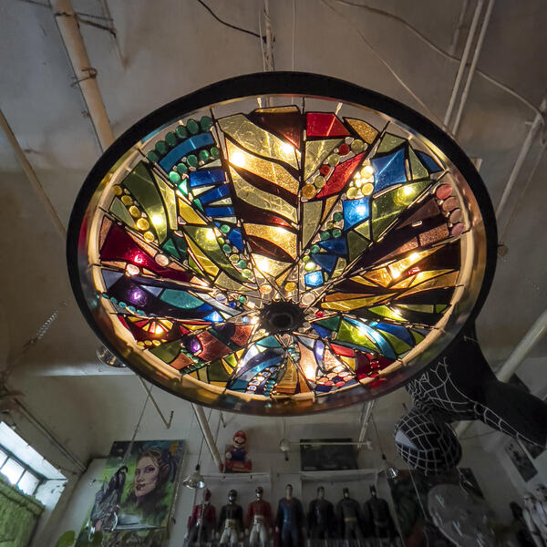 Bicycle wheel and stained glass chandelier