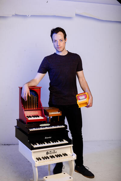 Benjamin Buchanan with Toy Piano Stack.jpg