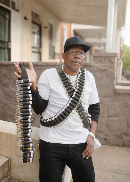 A man sells cologne in Reservoir Hill.