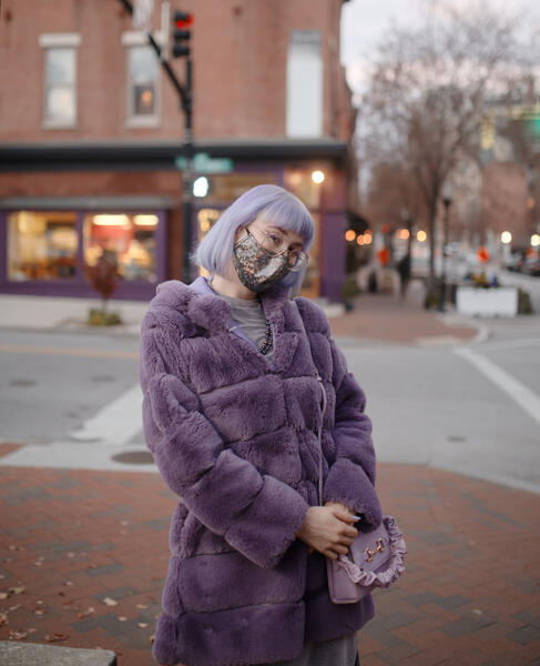 Woman in a purple coat in Mount Vernon.