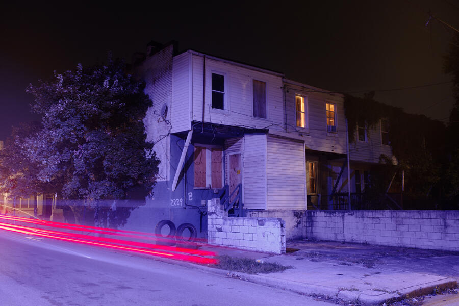 Purple light and passing car in Westport.