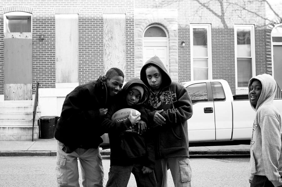 Children pose for a portrait in Harlem Park.