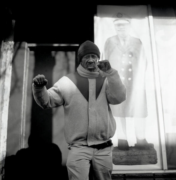 A man poses in Fells Point.