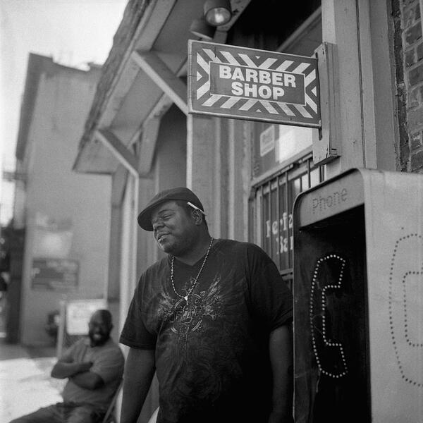 Mike at a barber shop near Lexington Market.