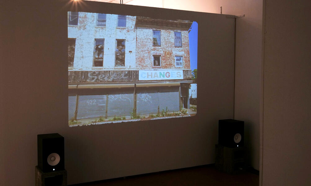 Installation view of gallery projection of BALTIMORE