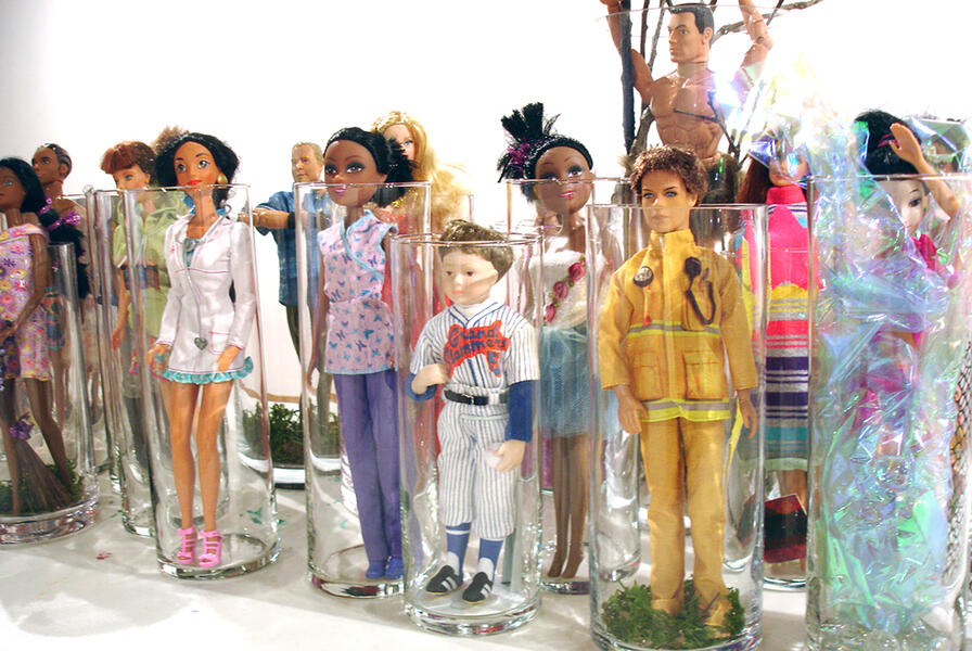 12 inch dolls were staged across an 8' x 4' acrylic mirror sectioned with a grid of Day-Glo tape.
