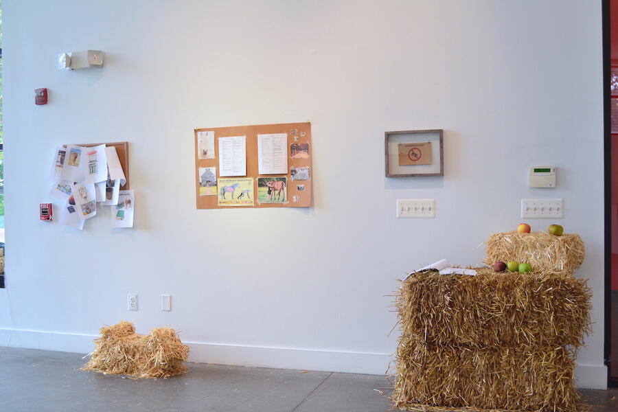 Horse Dorm, Installation View, collages, haystacks, apples, scripts