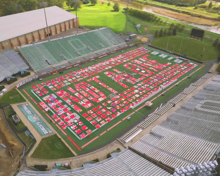 The Monument Quilt displayed on the football field at Ohio University