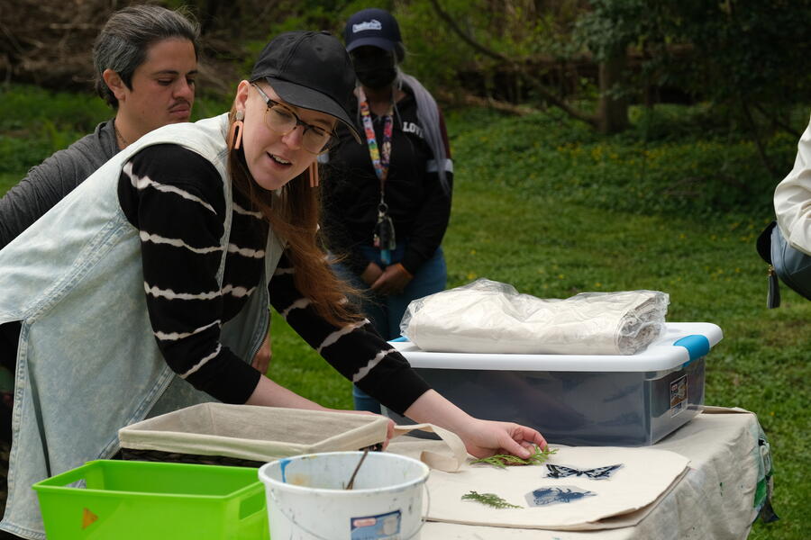 Maura leads participants in cyanotype process