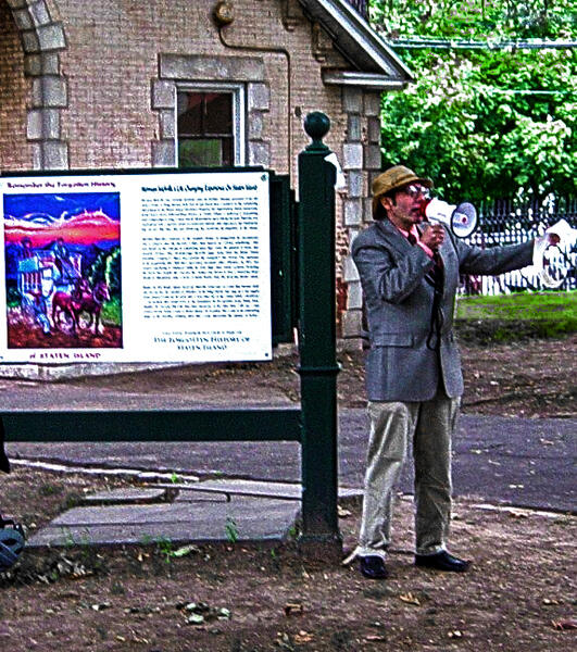 Photorecord of a live performance with the artist impersonating the controversial mythological, historian, Dr. D.I. Kniebocker, reading excerpts from the Forgotten History of Staten Island at the inaugural event for onsite installations September 17th, 20