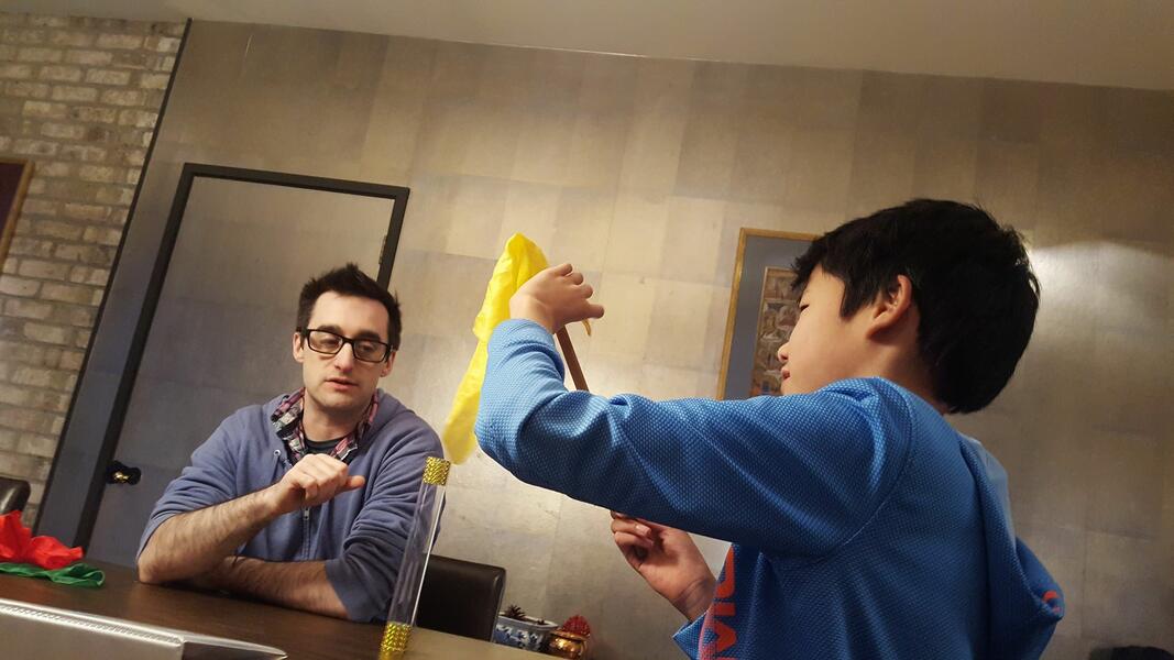 Renxian and Brian practice silk magic.