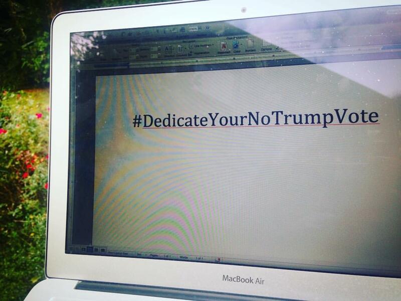 A computer screen with the words #DedicateYourNoTrumpVote
