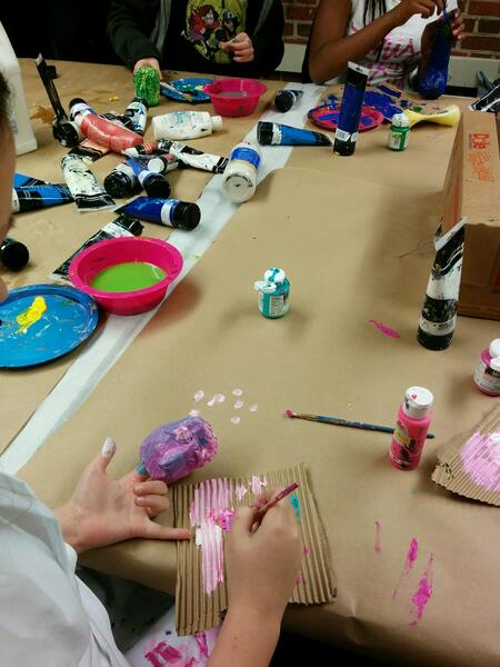 Children Painting Hand Puppet Heads They Designed and Built