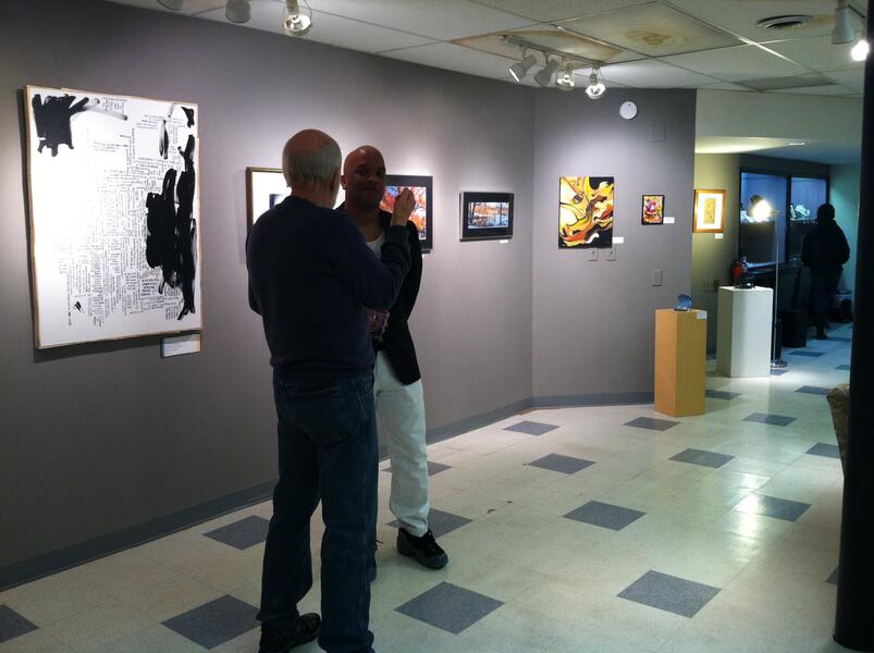 Artist and guest socializing at Hamilton Gallery