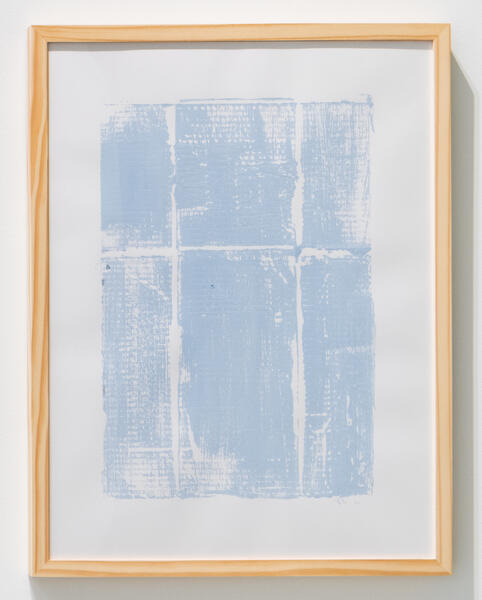 Light blue textural print inside of a wooden frame