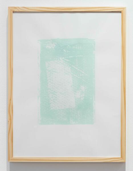 Light greenish-blue textural print inside of wooden frame