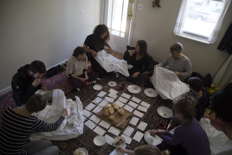 The Pilgrim House in Baltimore. Pilgrims break bread (the only food they'll have on pilgrimage) and read postcards sent from fellow travelers around the world. Photo by Katy McCarthy.