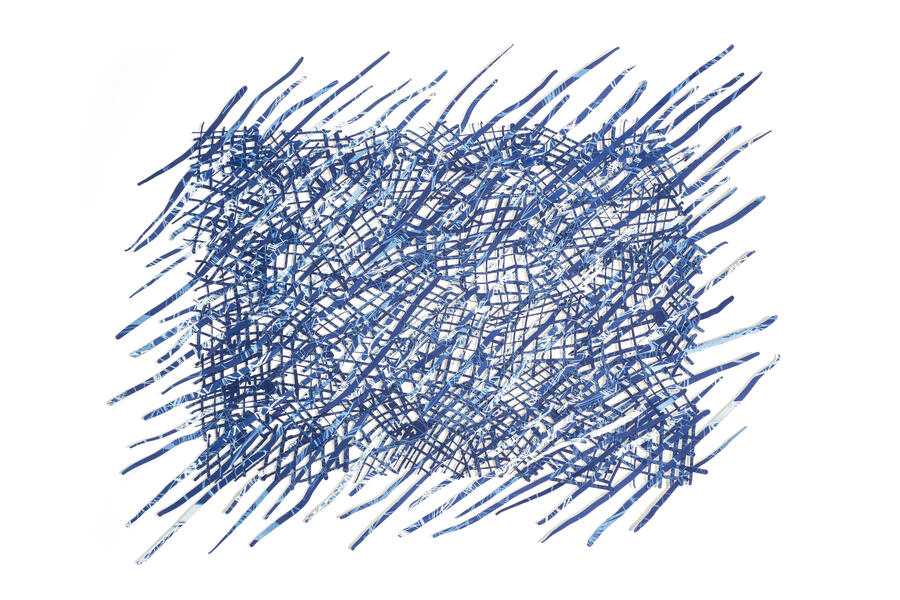 Paper wavy lines woven through a loose blue and white grid